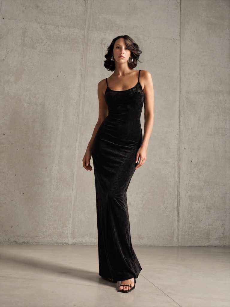 Woman in a long black velvet dress